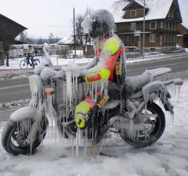 Frozen man on motorcycle.